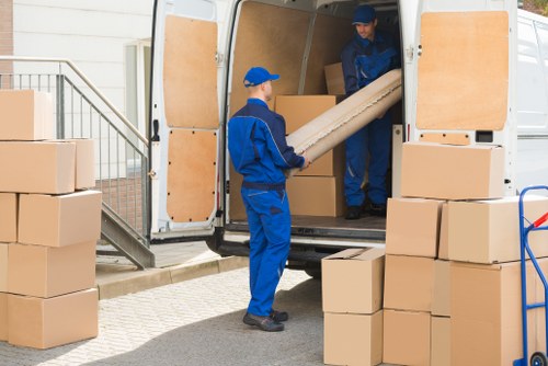 Removal team handling a flat move in Finchley with careful loading outside a residential building