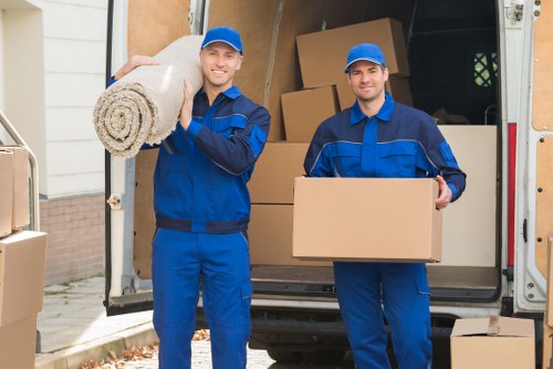 A Finchley moving team organizing boxes and furniture before transport