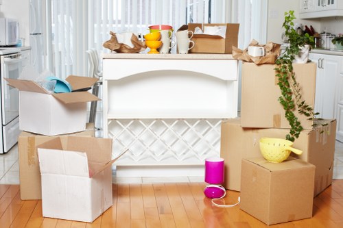 Local movers in Finchley transporting furniture through a residential property