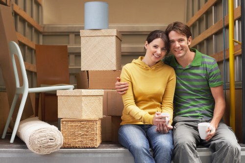 Professional movers loading items from a Finchley property