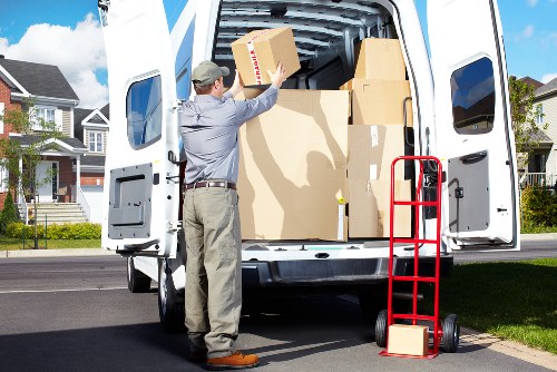 Careful loading of boxes and furniture into a removal van