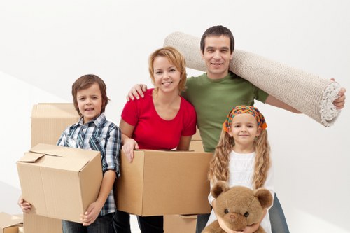 Careful wrapping of household items during a Finchley packing service
