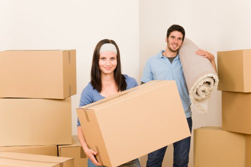 Boxes and room furniture being moved for a Finchley student relocation