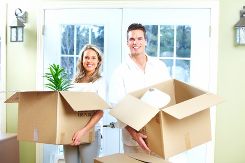 Removal staff carrying furniture carefully during a Finchley move