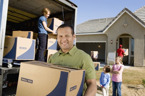 Professional movers handling office items in a Finchley workspace